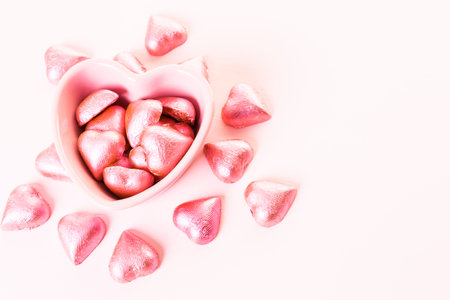 Heart shaped chocolates in pink foil.
