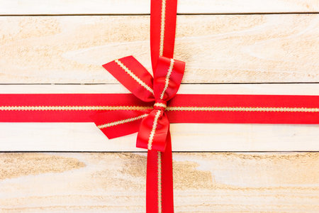 Classic bow made of wide red ribbon.の写真素材