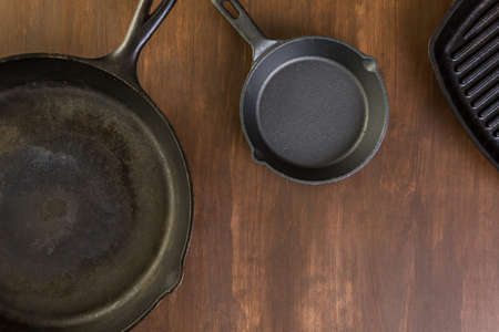 Cast iron skillet on rustic wood table.の写真素材