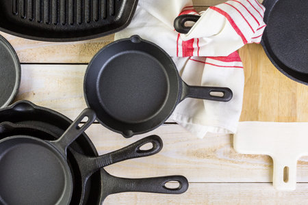 Cast iron skillet on rustic wood table.
