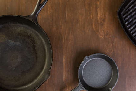 Cast iron skillet on rustic wood table.の写真素材