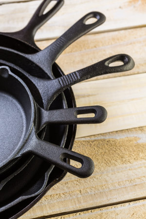 Cast iron skillet on rustic wood table.
