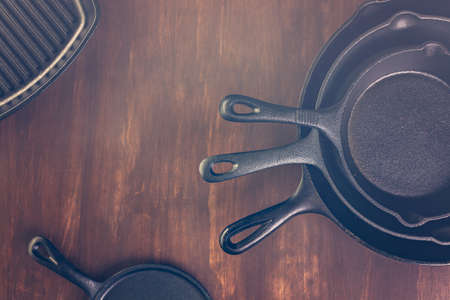 Cast iron skillet on rustic wood table.の写真素材