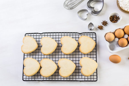 Baking heart shaped sugar cookies for Valentines Day.