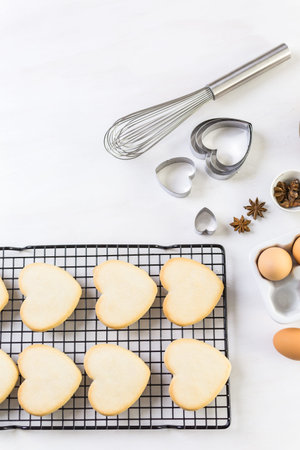 Baking heart shaped sugar cookies for Valentines Day.