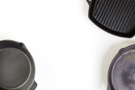 traditional cast iron skillet on a white background.