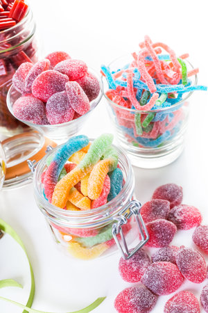 Variery of colorful candies on a white background.