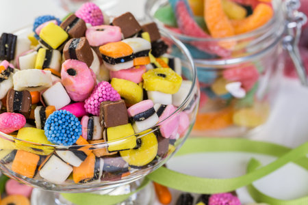 Variery of colorful candies on a white background.