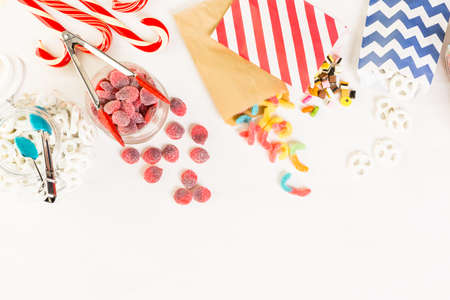 Multicolored candies on a white table.の写真素材