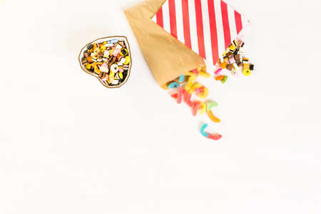 Multicolored candies on a white table.の写真素材