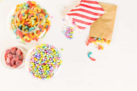 Multicolored candies on a white table.の写真素材