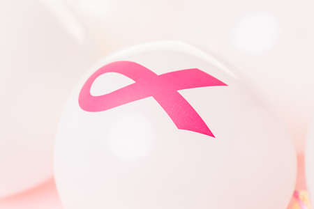 White latex balloos with pink reibbons.の写真素材