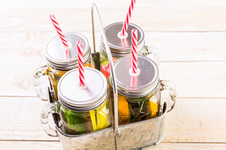 Detox citrus infused water as a refreshing summer drink.