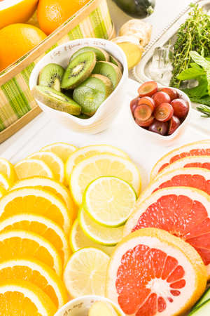 Ingredients for preparing detox citrus infused water as a refreshing summer drink.の写真素材