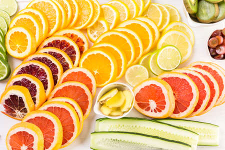 Ingredients for preparing detox citrus infused water as a refreshing summer drink.の写真素材