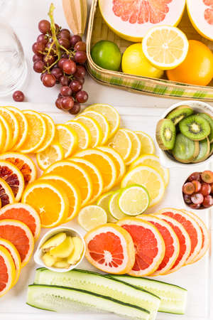 Ingredients for preparing detox citrus infused water as a refreshing summer drink.の写真素材