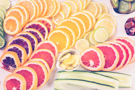 Ingredients for preparing detox citrus infused water as a refreshing summer drink.の写真素材