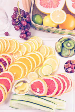 Ingredients for preparing detox citrus infused water as a refreshing summer drink.の写真素材