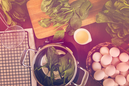 Dyeing Easter eggs with natural dye from spinach.の写真素材