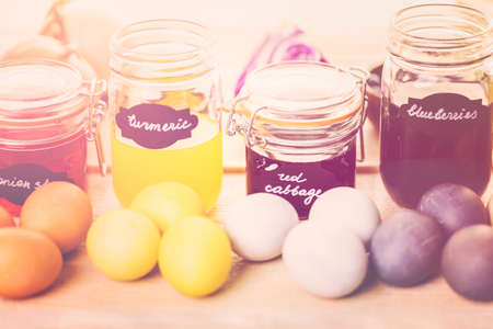 Easter eggs painted with natural egg dye from fruits and vegetables.の写真素材