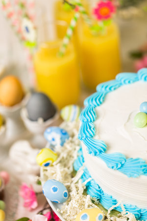 Dessert table set with cake and cupcakes for Easter brunch.の写真素材