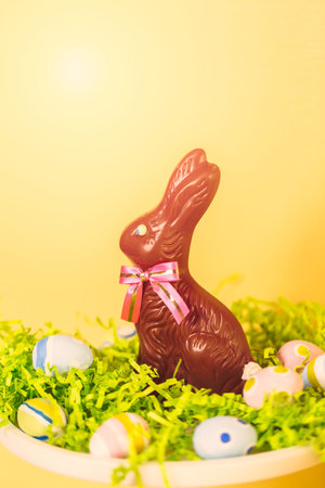 Chocolate bunny on decorated cake stand for Easter brunch.の写真素材
