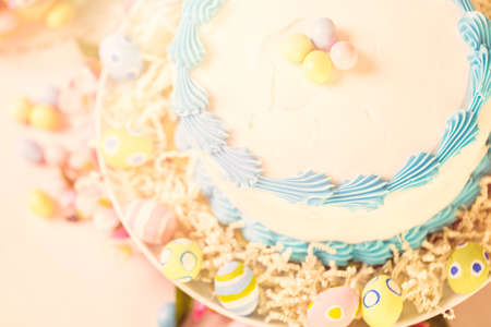 Dessert table set with cake and cupcakes for Easter brunch.の写真素材