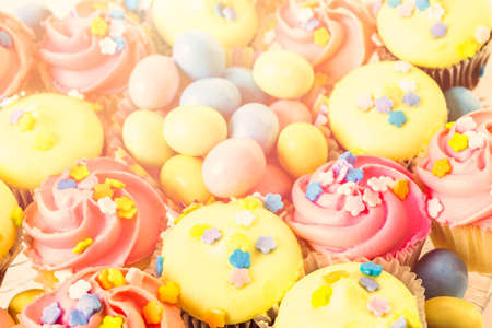 Miniature Easter cupcakes with pastel color iving.の写真素材