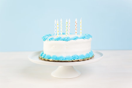 Simple white Birthday cake with cake candles.の写真素材