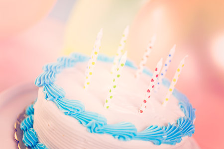 Simple white Birthday cake with cake candles.