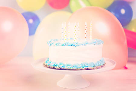 Simple white Birthday cake with cake candles.の写真素材