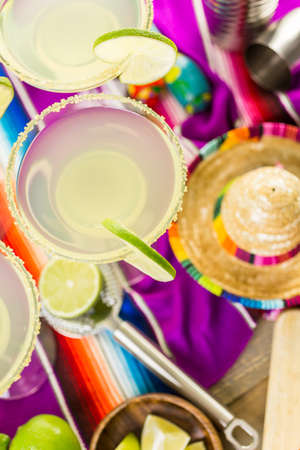 Classic lime margarita with garnish lime and turbinado sugarの写真素材