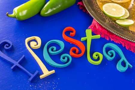 Spicy grapefruit margarita cocktail garnished with lime and jalapenos.の写真素材