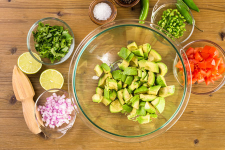 Preparing homemade guacamole from organic produce.の写真素材