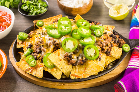 Claasic nachos with ground beef and fresh jalapeno chile peppers.の写真素材