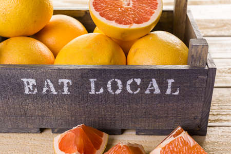 Fresh ryby red grapefruits in wood crate.の写真素材