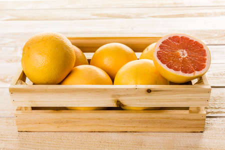 Fresh ryby red grapefruits in wood crate.の写真素材