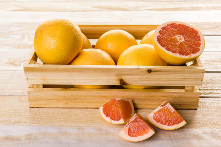 Fresh ryby red grapefruits in wood crate.の写真素材