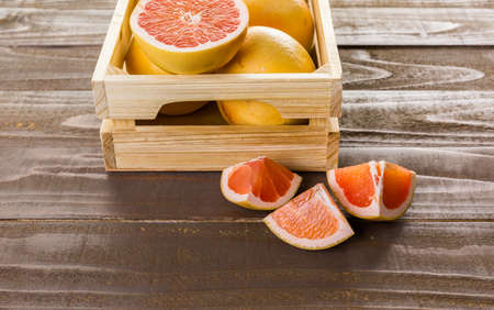 Fresh ryby red grapefruits in wood crate.の写真素材