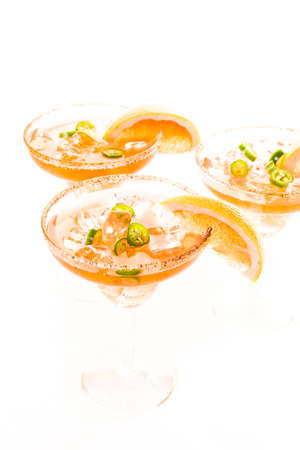 Spicy grapefruit margarita on ice in margarita glasses.の写真素材