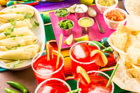 Party table with tamales, strawberry margartisa and pan dulche bread.の写真素材