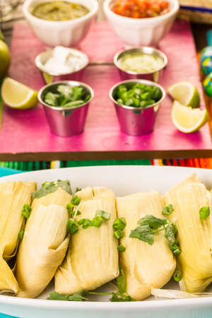 Home made tamales on serving plate on the party table.の写真素材