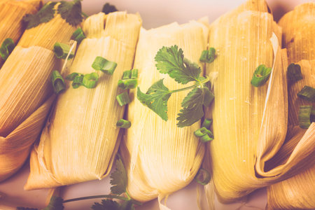 Home made tamales on serving plate on the party table.の写真素材