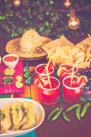 Party table with tamales, strawberry margartisa and pan dulche bread.の写真素材