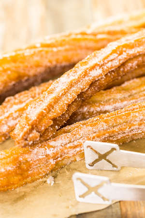 Bunch of curros covered with granulated sugar.の写真素材