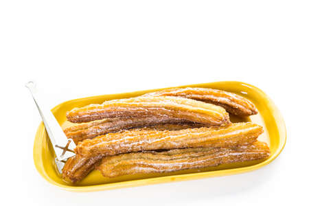 Bunch of curros covered with granulated sugar.の写真素材