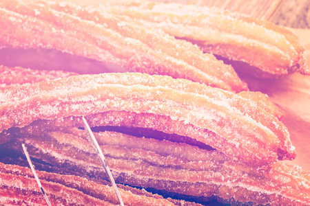 Bunch of curros covered with granulated sugar.の写真素材