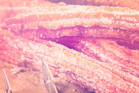 Bunch of curros covered with granulated sugar.の写真素材