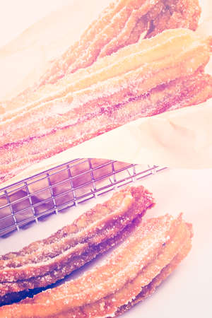 Bunch of curros covered with granulated sugar.の写真素材