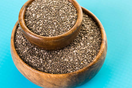 Healthy Chia seeds in a wooden bowl close-up.の写真素材